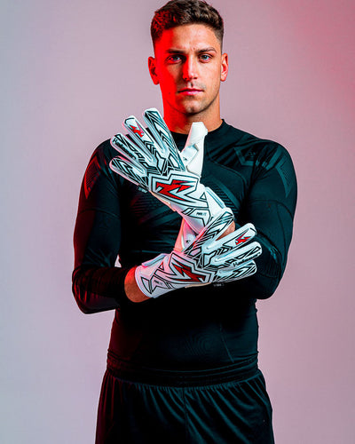 person wearing Kaliaaer red and black goalkeeper gloves