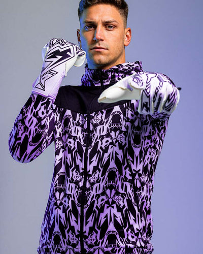 Person wearing the kaliaaer black and white secure cut goalkeeper gloves