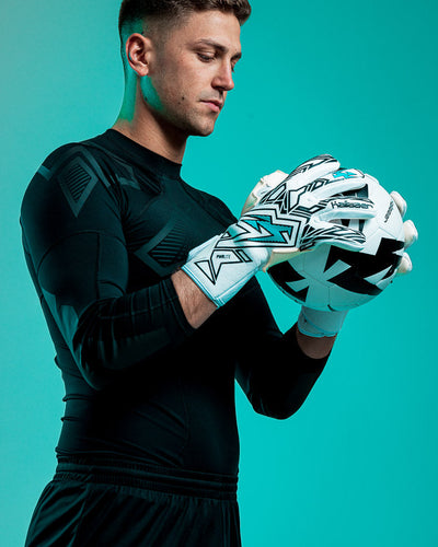 Person wearing Kaliaaer blue and white junior goalkeeper gloves