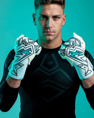 Person wearing Kaliaaer blue and white junior goalkeeper gloves