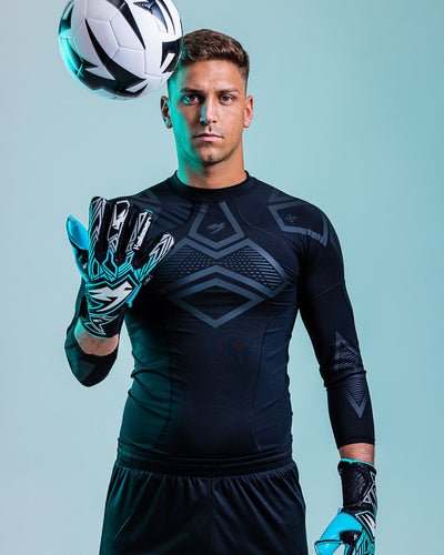 Person with Football wearing kaliaaer ignite goalkeeper gloves