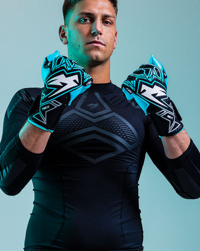 Person Wearing junior blue Kaliaaer ignite goalkeeper gloves