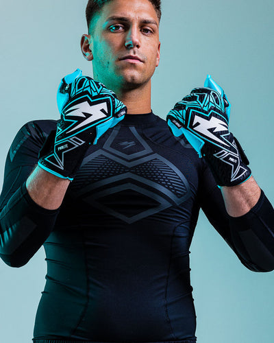 Person wearing kaliaaer ignite blue goalkeeper gloves