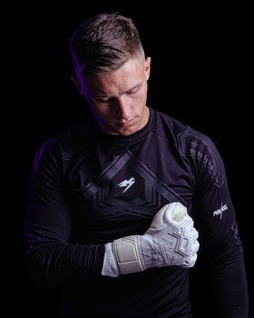 A person wearing the Jack Butland Kaliaaer Junior goalkeeper gloves
