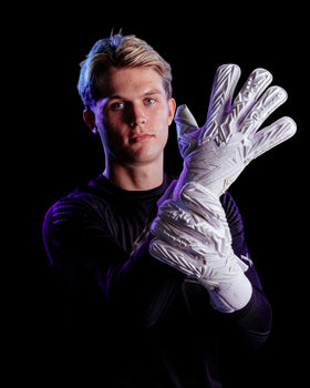 A person showing the backhand of the Kaliaaer PWRpro goalkeeper gloves