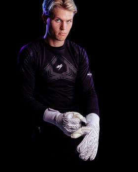 A person facing the strap of the kaliaaer pwrpro goalkeeper gloves