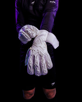 A person showing the back pf the kaliaaer white out pwr pro goalkeeper gloves