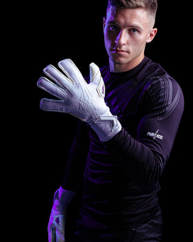 A person wearing white kaliaaer goalie gloves with logo