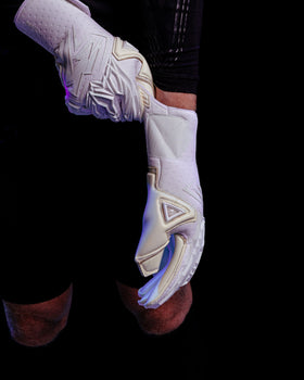 A person pulling on the kaliaaer pwrpro goalkeeper gloves