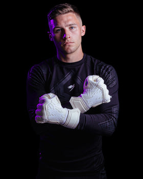 A person showing the back of kaliaaer white goalkeeper gloves