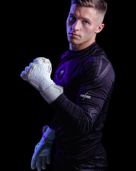 A person shows the first angle of kaliaaer nitropro goalkeeper gloves in white