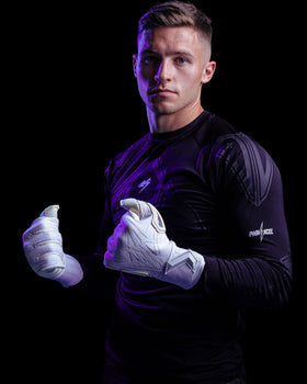 Person wearing white kaliaaer Goalkeeper gloves