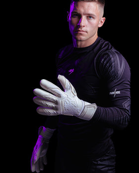 A person showing the back side of the Kaliaaer nitropro goalkeeper gloves