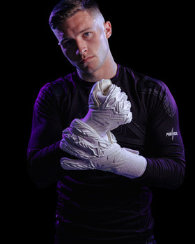 A person making a fist while wearing Kaliaaer PWRpro goalkeeper gloves