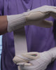 A person showing the kaliaaer nitrolite junior goalkeeper gloves