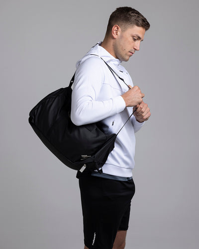 A person carrying the Kaliaaer Pro Travel bag.