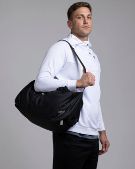 A person carrying the Kaliaaer Pro Travel bag.