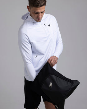 A person using the Kaliaaer Pro Gym sack.