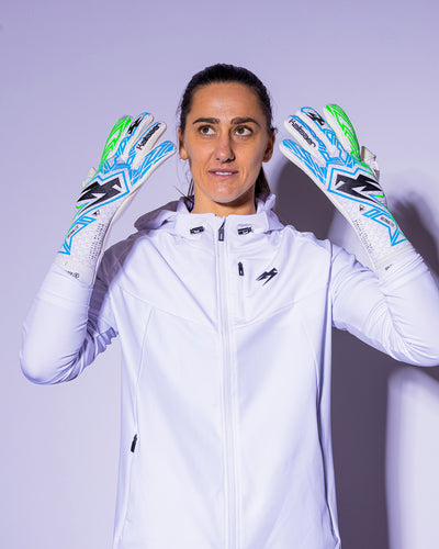 Girl wearing strapless green and blue kaliaaer goalkeeper gloves