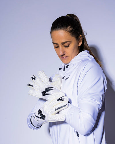 Girl holding kaliaaer strapless white junior goalie gloves