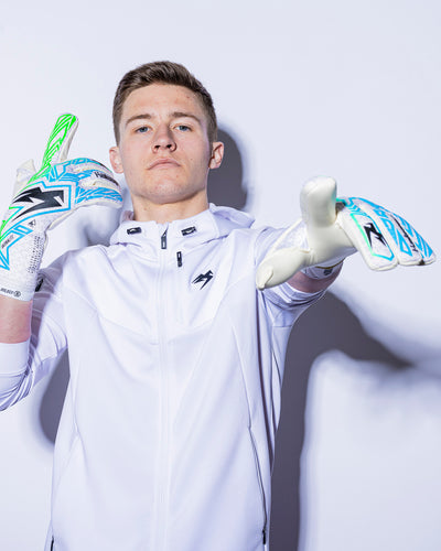 Boy wearing kaliaaer strapless green and blue goalkeeper gloves