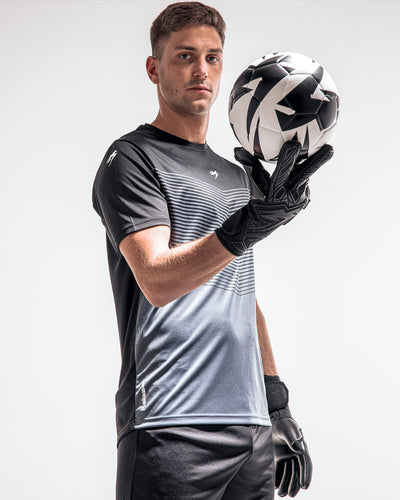 Person wearing Kaliaaer Black Roll finger goalkeeper gloves