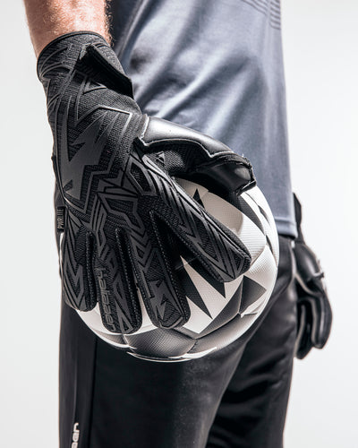 person wearing kaliaaer triple black goalkeeper gloves