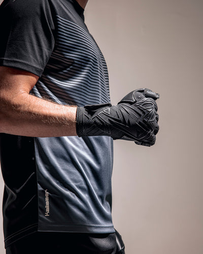 Person holding Kaliaaer Roll Finger Black Goalkeeper Gloves