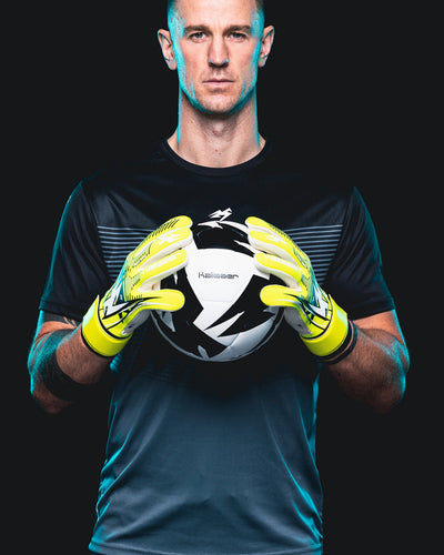 Joe Hart holding a football wearing Neo JH Goalkeeper Gloves