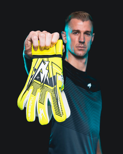 JH holding up the Neo Yellow Nitrolite Goalkeeper Gloves