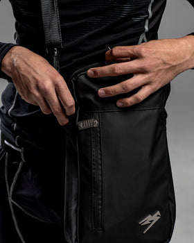 A person unzipping the Kaliaaer Pro Glove bag in black.